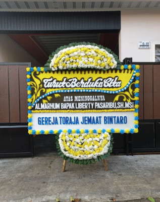 Papan Bunga Duka di Benda Baru